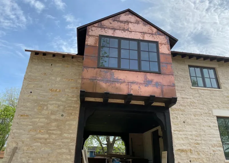 Copper metal panel facade on a stone building for Metal Roof Coating in Pendleton